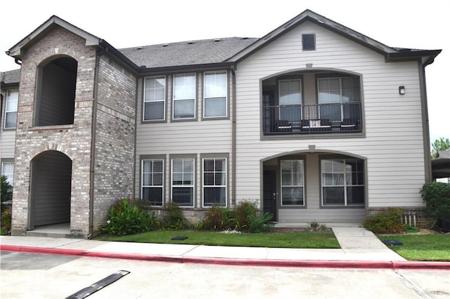 350 Emerald Forrest Blvd Unit 24103, Covington, LA 70433 - traditional-style home featuring brick siding and a balcony