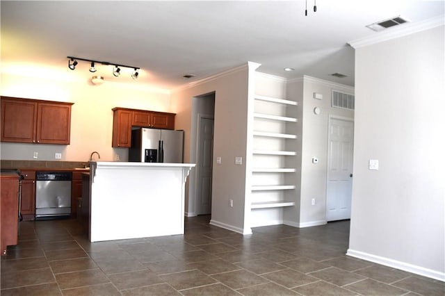 350 Emerald Forrest Blvd Unit 24103, Covington, LA 70433 - kitchen with appliances with stainless steel finishes, built in features, crown molding, brown cabinets, and dark tile patterned floors