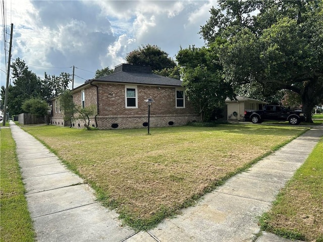 4317 James Dr, Metairie, LA 70003 - view of side of home featuring crawl space, brick siding, a lawn, and roof with shingles