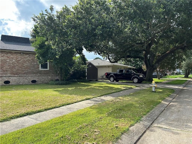 4317 James Dr, Metairie, LA 70003 - view of green lawn featuring concrete driveway