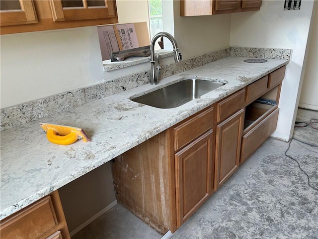 4317 James Dr, Metairie, LA 70003 - kitchen with brown cabinets and light stone counters