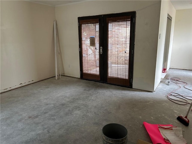 4317 James Dr, Metairie, LA 70003 - spare room with french doors, unfinished concrete flooring, and ornamental molding