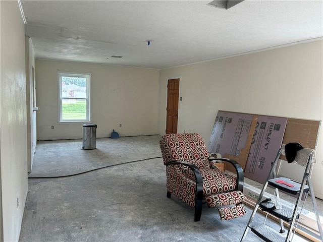 4317 James Dr, Metairie, LA 70003 - living area with unfinished concrete floors and crown molding