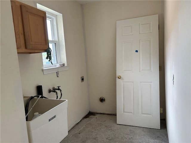 4317 James Dr, Metairie, LA 70003 - laundry area featuring cabinet space and electric dryer hookup