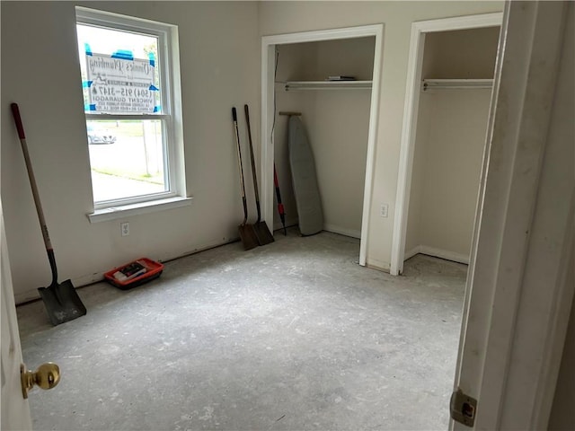 4317 James Dr, Metairie, LA 70003 - unfurnished bedroom featuring multiple closets