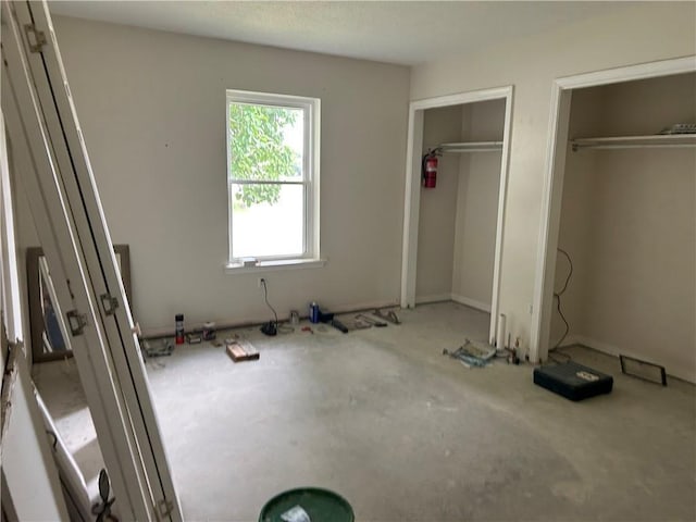 4317 James Dr, Metairie, LA 70003 - unfurnished bedroom featuring multiple closets