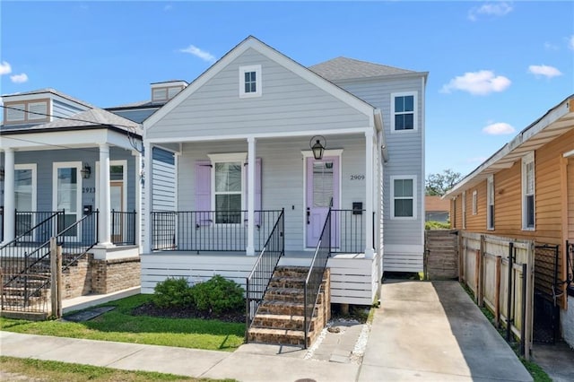 2909 Amelia St, New Orleans, LA 70115 - shotgun-style home with a porch