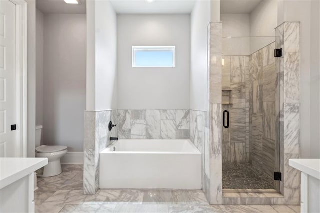 2909 Amelia St, New Orleans, LA 70115 - bathroom with vanity, a bath, a stall shower, and marble finish flooring