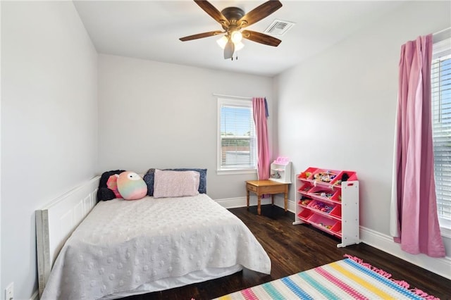 2909 Amelia St, New Orleans, LA 70115 - bedroom with wood finished floors and ceiling fan