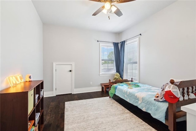 2909 Amelia St, New Orleans, LA 70115 - bedroom featuring dark wood-style flooring and a ceiling fan