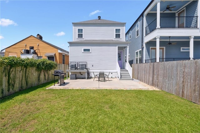 2909 Amelia St, New Orleans, LA 70115 - back of property featuring ceiling fan, a balcony, and a fenced backyard
