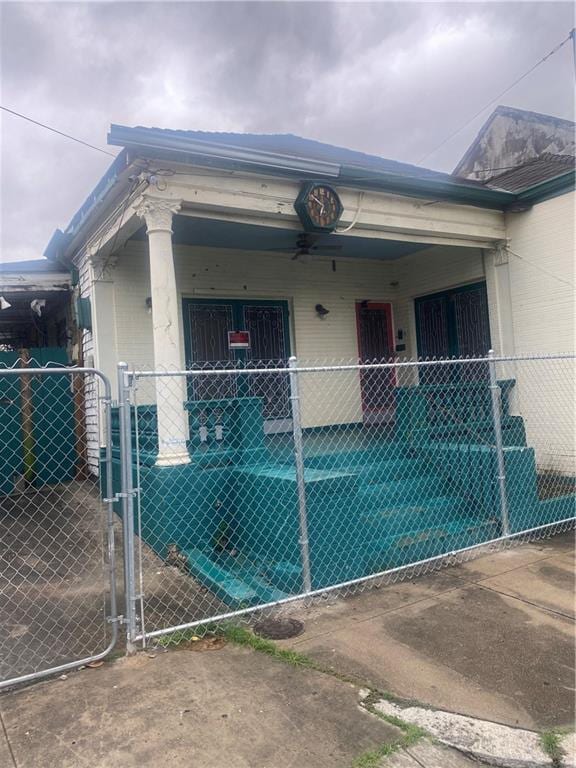 1122 Henriette Delille St, New Orleans, LA 70116 - view of side of home with a gate
