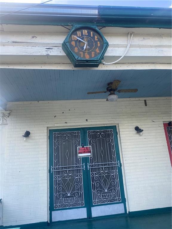 1122 Henriette Delille St, New Orleans, LA 70116 - view of exterior entry with brick siding and ceiling fan