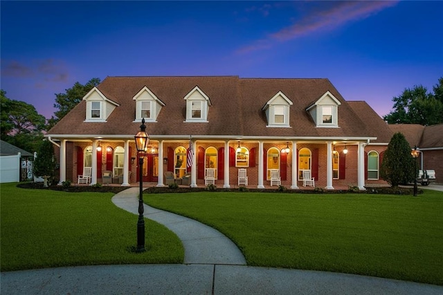 299 Sarah Victoria Dr, Belle Chasse, LA 70037 - cape cod house with a porch and a yard