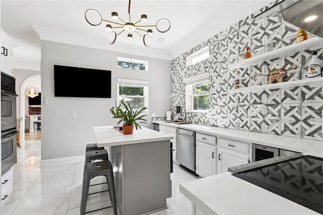 299 Sarah Victoria Dr, Belle Chasse, LA 70037 - kitchen featuring a chandelier, appliances with stainless steel finishes, ornamental molding, and light countertops