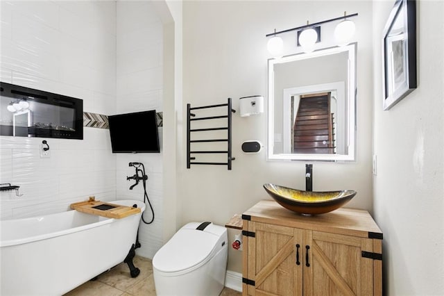 299 Sarah Victoria Dr, Belle Chasse, LA 70037 - full bath featuring a soaking tub, vanity, and tile patterned flooring