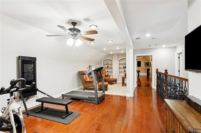 299 Sarah Victoria Dr, Belle Chasse, LA 70037 - workout area with wood finished floors, a ceiling fan, built in shelves, recessed lighting, and vaulted ceiling