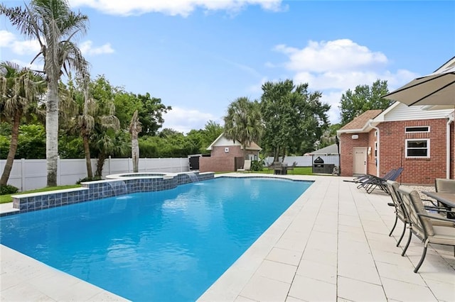 299 Sarah Victoria Dr, Belle Chasse, LA 70037 - view of swimming pool featuring a fenced backyard, a pool with connected hot tub, and a patio area