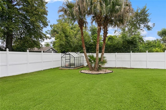 299 Sarah Victoria Dr, Belle Chasse, LA 70037 - fenced backyard with an exterior structure and an outbuilding