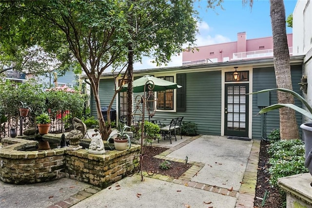 718 Ursulines Ave Unit D, New Orleans, LA 70116 - back of property featuring a patio area