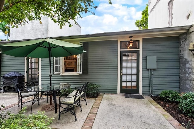 718 Ursulines Ave Unit D, New Orleans, LA 70116 - doorway to property featuring a patio and outdoor dining area