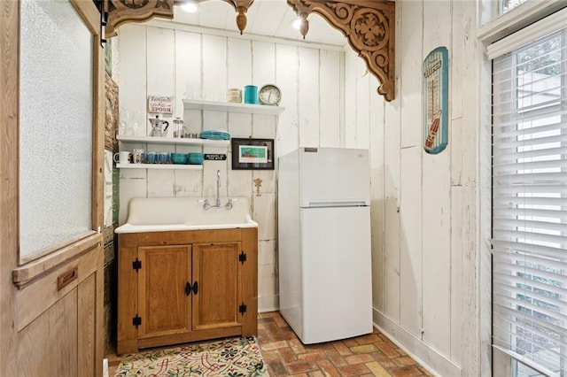 718 Ursulines Ave Unit D, New Orleans, LA 70116 - bathroom with brick floors and vanity