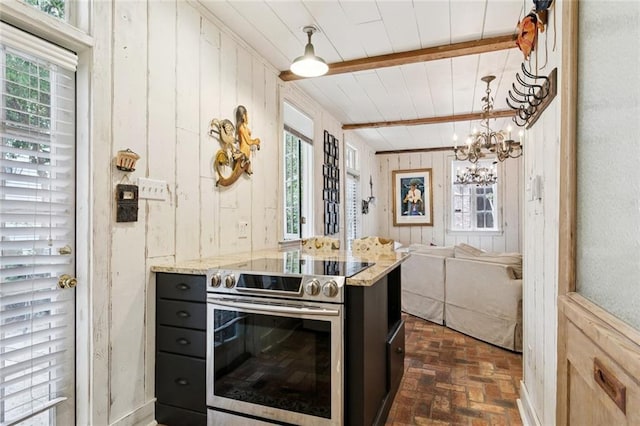 718 Ursulines Ave Unit D, New Orleans, LA 70116 - kitchen featuring electric range, wooden walls, brick flooring, a wooden ceiling with exposed beams, and dark cabinets