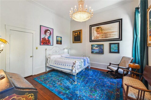 2512 Magazine St Unit D, New Orleans, LA 70130 - bedroom featuring a chandelier, wood finished floors, and crown molding