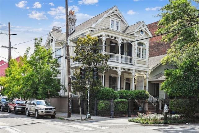 639 Esplanade Ave, New Orleans, LA 70116 - victorian-style house with a balcony and a porch