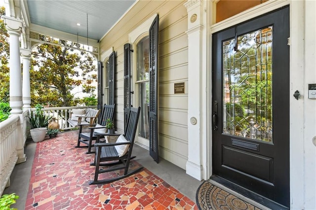 639 Esplanade Ave, New Orleans, LA 70116 - doorway to property featuring a porch