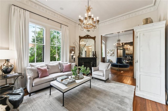 639 Esplanade Ave, New Orleans, LA 70116 - living area with a chandelier, hardwood / wood-style flooring, and crown molding