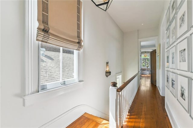 639 Esplanade Ave, New Orleans, LA 70116 - hall featuring hardwood / wood-style flooring and an upstairs landing