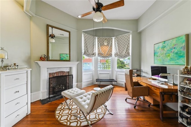 639 Esplanade Ave, New Orleans, LA 70116 - office area with ceiling fan, a brick fireplace, and hardwood / wood-style flooring