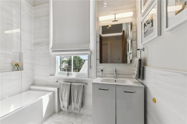 639 Esplanade Ave, New Orleans, LA 70116 - bathroom with vanity and tile walls