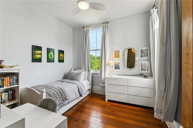 639 Esplanade Ave, New Orleans, LA 70116 - bedroom featuring dark wood finished floors and ceiling fan
