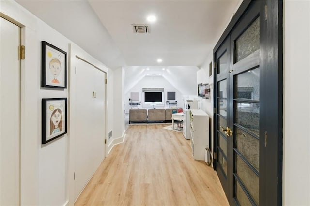 639 Esplanade Ave, New Orleans, LA 70116 - corridor featuring light wood-style floors, recessed lighting, and lofted ceiling