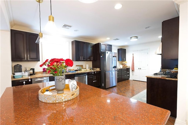 6640 Louisville St, New Orleans, LA 70124 - kitchen with stainless steel appliances, dark stone countertops, recessed lighting, pendant lighting, and dark brown cabinets