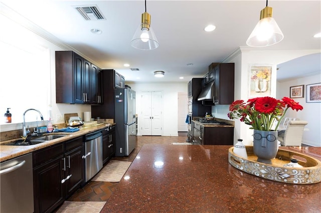 6640 Louisville St, New Orleans, LA 70124 - kitchen featuring stainless steel appliances, under cabinet range hood, dark stone counters, pendant lighting, and recessed lighting
