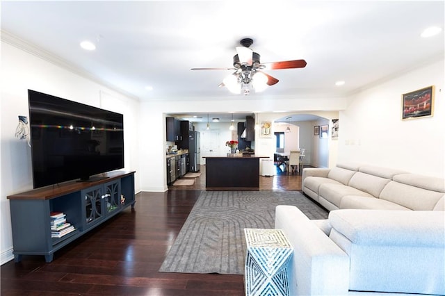 6640 Louisville St, New Orleans, LA 70124 - living room featuring arched walkways, crown molding, ceiling fan, dark wood finished floors, and recessed lighting