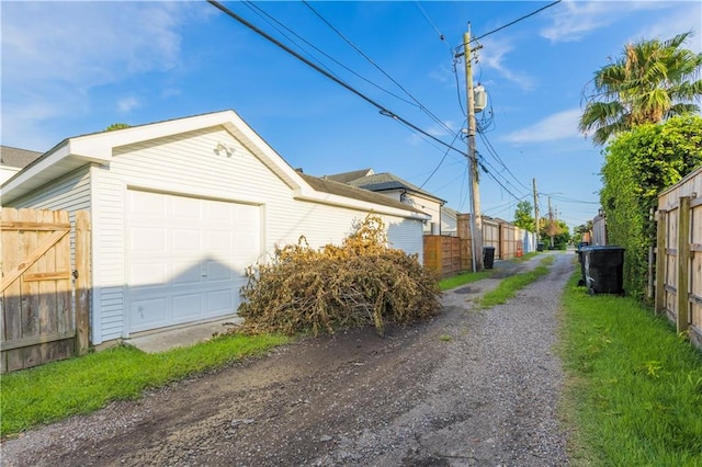 6640 Louisville St, New Orleans, LA 70124 - view of side of home featuring an attached garage