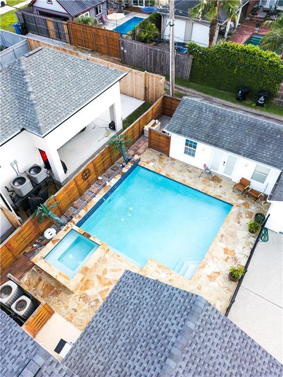 6640 Louisville St, New Orleans, LA 70124 - view of swimming pool featuring a fenced backyard, a patio, and a pool with connected hot tub