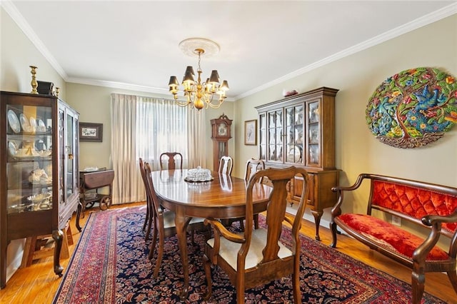4519 Bancroft Dr, New Orleans, LA 70122 - dining room featuring a chandelier, ornamental molding, and light wood-style floors