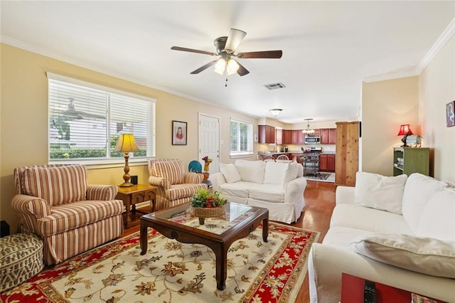 4519 Bancroft Dr, New Orleans, LA 70122 - living room featuring ornamental molding, wood finished floors, and a ceiling fan