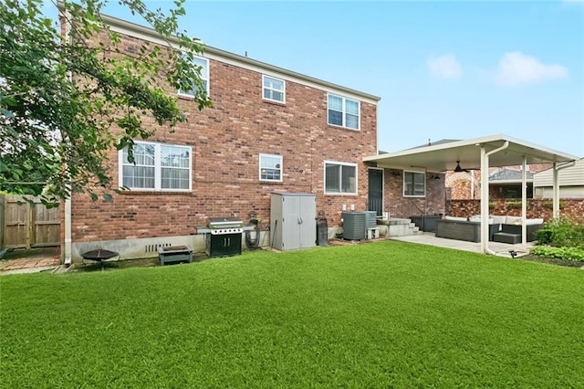 4519 Bancroft Dr, New Orleans, LA 70122 - back of house with ceiling fan, brick siding, an outdoor hangout area, and a patio