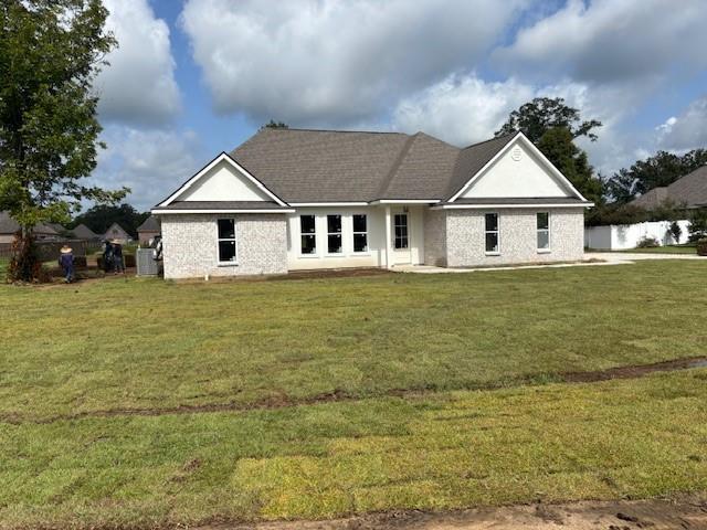 53357 Phillips Path, Loranger, LA 70446 - back of house with a lawn and brick siding