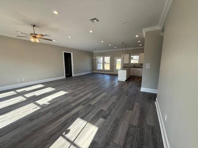 53357 Phillips Path, Loranger, LA 70446 - unfurnished living room with ornamental molding, dark wood-type flooring, a ceiling fan, and recessed lighting