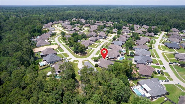 1521 Rue De Fontaine, Covington, LA 70433 - aerial overview of property's location with a forest and nearby suburban area