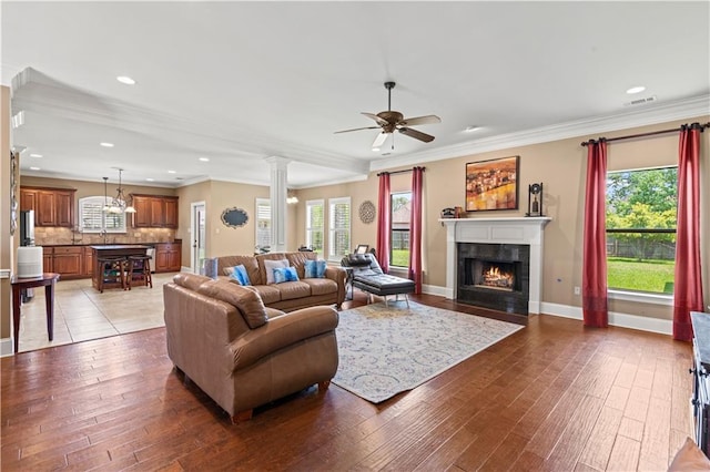 1521 Rue De Fontaine, Covington, LA 70433 - living area featuring hardwood / wood-style floors, plenty of natural light, a ceiling fan, a fireplace, and recessed lighting