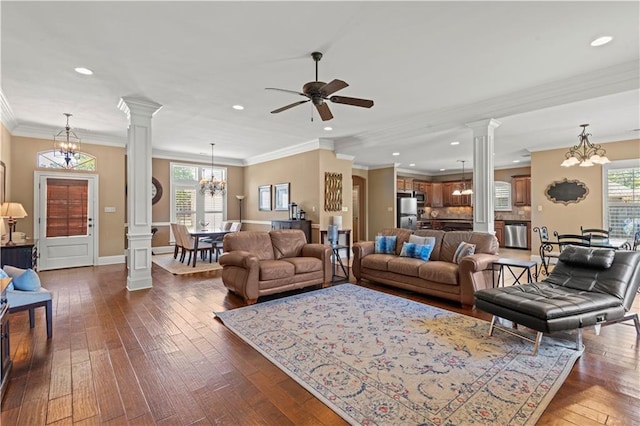 1521 Rue De Fontaine, Covington, LA 70433 - living room with ornate columns, a chandelier, dark wood finished floors, a ceiling fan, and recessed lighting