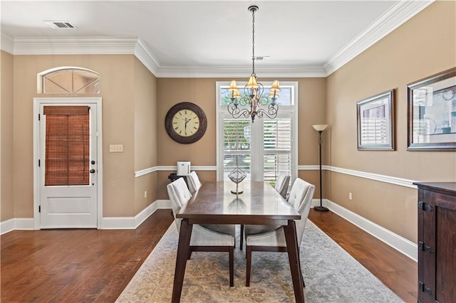 1521 Rue De Fontaine, Covington, LA 70433 - dining room with a chandelier, wood finished floors, and crown molding